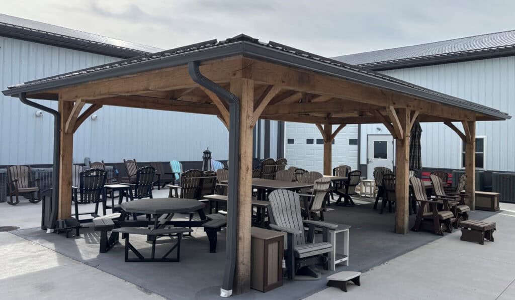 Covered custom pavilion extending outdoor living space with a roofed structure attached.