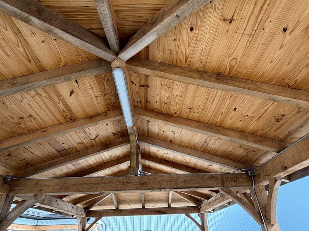 Large custom backyard pavilion built by Amish craftsmen with solid wood posts and traditional construction.